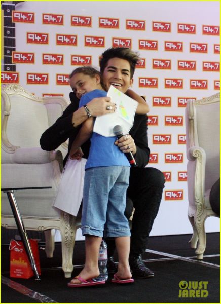 adam-lambert-hugs-lucky-young-fan-in-south-africa-04.jpg